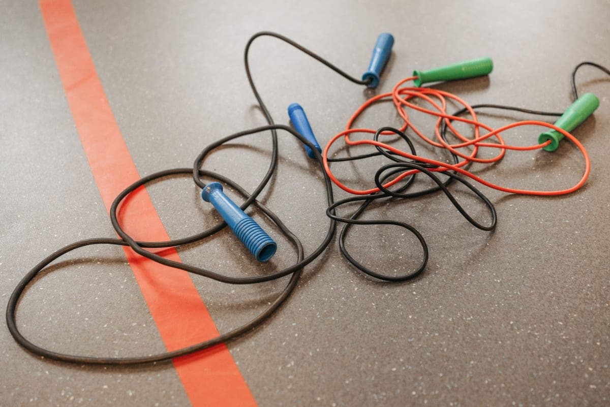 Jump ropes lying on a gym floor